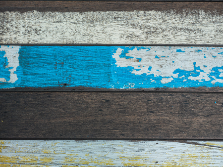 Vintage wood background and texture with colourful peeling paintの写真素材