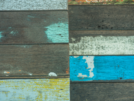 Vintage wood background and texture with colourful peeling paintの写真素材