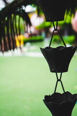 rain chain element architecture roof old temple garden japanese metal.rain chain japan design architecture closeup style vintage outdoor building asian. asia rain iron chain hanging, selected focus.の写真素材
