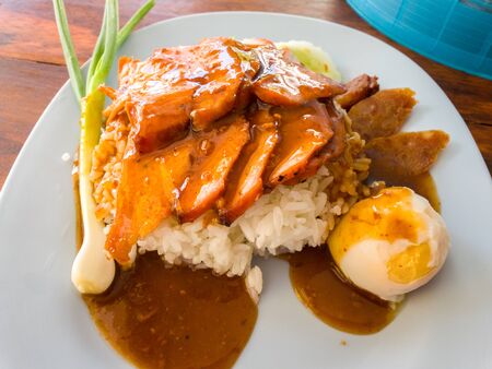 Barbecued red pork in sauce with rice. Thai Pork Menu.の写真素材