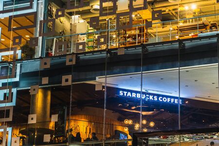 The BANGKOK, THAILAND - JULY 26,2018:Starbucks Coffee is an American chain of coffee shops,founded in Bangkok. Siam Discovery shopping mall at Siam Square on JULY 26, 2018 in Bangkok, Thailand.のeditorial素材
