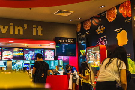 The BANGKOK, THAILAND - JULY 25,2018:MC DONALDS RESTAURANT Sign board at Amarin Plaza is shopping mall located in the centre of Bangkok's Ratchaprasong district on JULY 25, 2018 in Bangkok, Thailandのeditorial素材