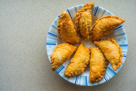 Curry puff is a snack of Southeast Asian origin. It is a small pie consisting of curry with chicken...