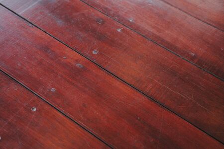 The Natural light brown wooden parquet floor boards. Sunny soft yellow texture, copy space perspective background.の写真素材
