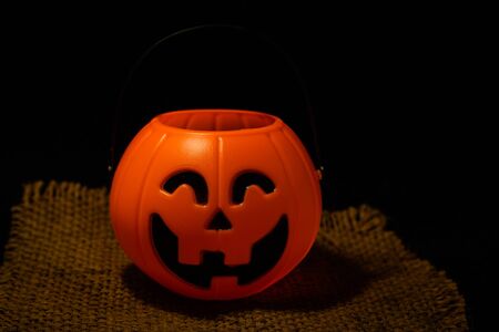 The Halloween pumpkin on dark background with space for textの写真素材