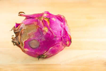A Dragon fruit. The rare dragon fruit on a wooden backgroundの写真素材