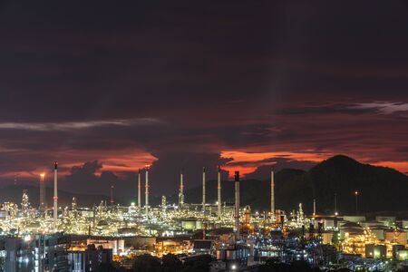 The Oil refinery is located in one of the city during the sunset behind the hills to the sea, a beautiful pictures can be made into a background imageの写真素材