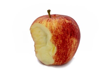 A Red apple with missing a bite isolated on white backgroundの写真素材