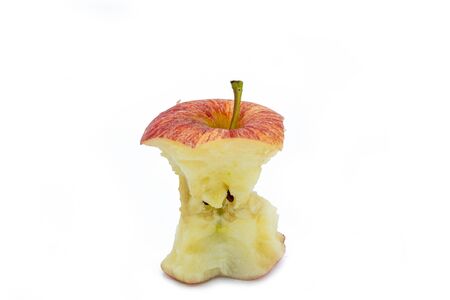 A Ripe red apple core after Bitten on white backgroundの写真素材