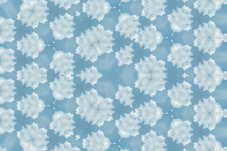 The abstract reflection of white clouds and blue sky cloudscape for background use, kaleidoscope imageの写真素材