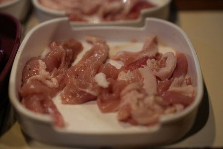 The sliced raw pork meat isolated on white background. Top view.の写真素材