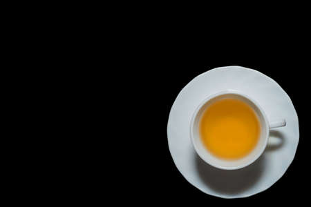 Jasmine tea cup in black background with left copyspaceの写真素材