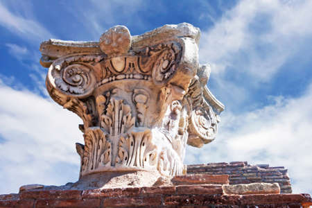 Ancient Roman capital close up in archaeological excavations of Ostia Antica - Rome - Italyの写真素材