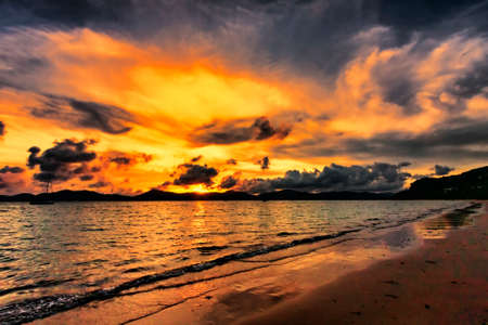 Thai seascape sunset in front of Puketの写真素材