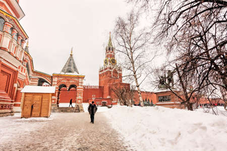 Moscow, Russian Federation - January 28, 2017 :The Moscow Kremlin,  Red Square cover by snow adjacent San Basil Cathedral with landscape of Spasskaya tower.のeditorial素材