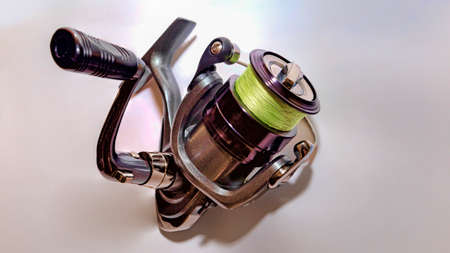 Spinning reel mounted with yellow threadの写真素材