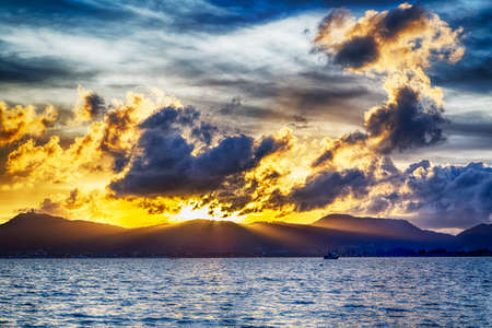 Thai seascape sunset in front of Puketの写真素材