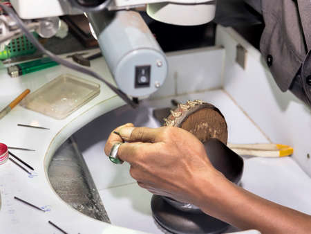 Goldsmith at work with traditional tools - selectived focusの写真素材