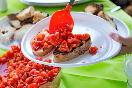 Outdoor aperitif with typical Italian bruschetta - selective focus