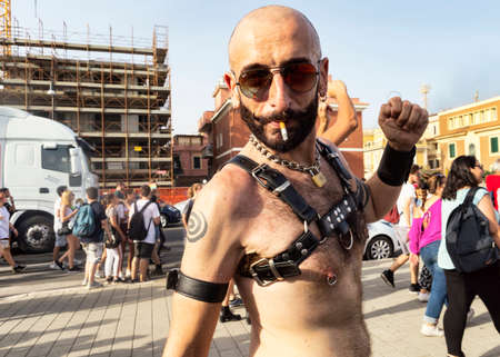 Ostia Lido Rome, Italy - July 14, 2018 :Cute boy poses for the camera in Lazio pride day in Rome. Lazio Pride it s event for the rights, protection and pride of LGBTI people (Lesbian, Gay, Bisex, Trans and Intersex).のeditorial素材