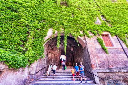 Rome,Italy - July 19, 2018:Tourists climb the ancient staircase under Palazzo Borgia to lead to San Pietro in Vincoli square in Monti district in Romeのeditorial素材