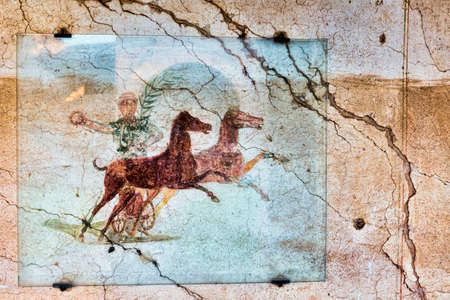 Fresco with the Aurighi in a corridor of the Aurighi tenement in the archaeological excavations of Ancient ostia - Romeのeditorial素材