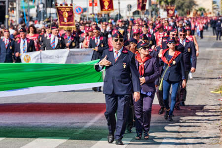 Rome,Italy - September 30, 2018:  In occasion of the 50th anniversary of the foundation of the National Association of Italian State Police, a huge Italian tricolor flag flag is transported by the members of Association of Italian State Police on the Romaのeditorial素材