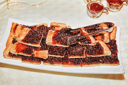 Tray with many pieces of icing blueberry pieの写真素材