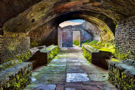 Looking at the exit inside the thermal's mithraeum in archaeological excavations of Ostia Antica -...