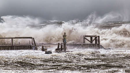 Stormy winter sea with high waves and wind crashes on the Roman costの写真素材