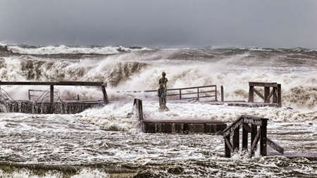Stormy winter sea with high waves and wind crashes on the Roman costの写真素材