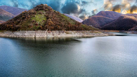 Sunset on the Turano lake and its mountains - Italy