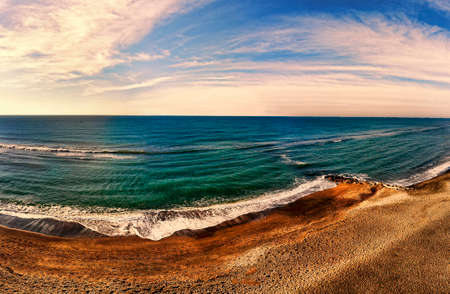 Panorama seascape view above the ocean with sand water and scenic skyの写真素材