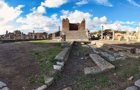 Panorama at archaeological excavations of Ostia Antica with the Capitolium  surrounded by ruins, columns and remains of statues and bas-reliefsのeditorial素材