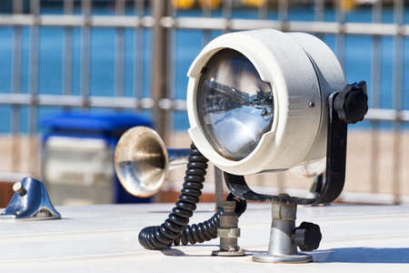 A useful beacon fixed on a white fiberglass boatの写真素材