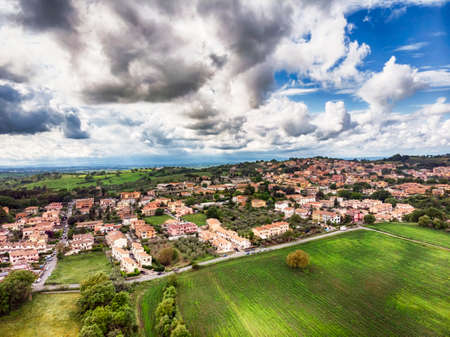 Awe aerial view from green hills of Rignano Flaminio village in italy surrounded by forest and countrysideの写真素材