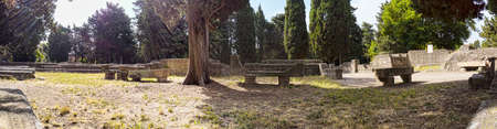 Immersive panoramic 180 degree view of ancient Roman necropolis landmark in the archaeological excavations of Ostia Antica with many sarcophagus and graves  - Rome, Italyの写真素材