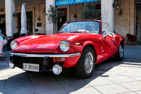Rome, Italy - July 20, 2019: On occasion of Rome capital city Rally event, an exhibition of vintage cars has been set up with the beutiful red car model Spitfire 1300 from Triumph Motor Company automakerのeditorial素材