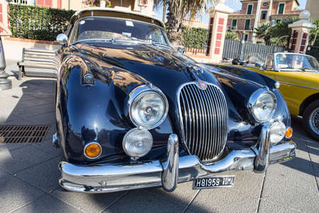 Rome,Italy - July 20, 2019:On occasion of  Rome capital city Rally event, an exhibition of vintage cars has been set up with the beutiful black car model Jaguard XK150  manufactured by British Jaguard automaker from 1957 to 1961のeditorial素材