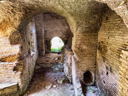 Corridor with Roman vault inside an ancient building in the archaeological excavations of Ostia Antica in Rome, Italyの写真素材