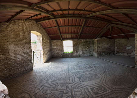 Room with the beautiful mosaics of the Dioscuri present in the Domus of Dioscuri located in the archaeological excavations of Ostia Antica in Romeの写真素材
