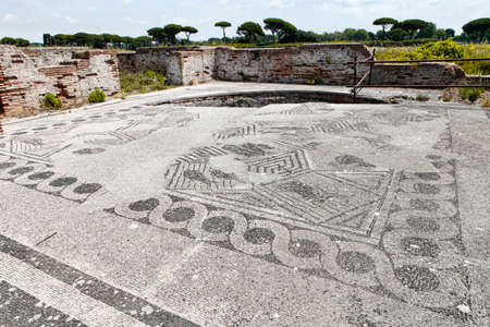 View of the eastern environment of the ancient Roman ruins of Porta Marina's thermal baths, with beautiful paving mosaicの写真素材