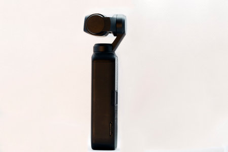 Rome, Italy - December 04, 2020: Profile view of compact camera named Osmo Pocket famous for its portability and high quality of image and video, equipped with three-axis gimbal stabilizer, produced from 15 December 2018 by DJI company.のeditorial素材