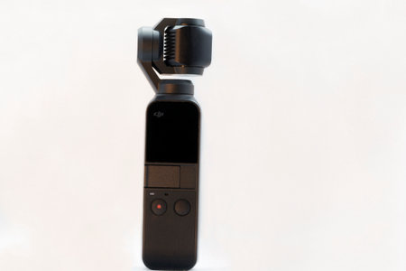 Rome, Italy - December 04, 2020: Famous design of compact camera named Osmo Pocket famous for its portability and high quality of image and video, equipped with three-axis gimbal stabilizer, produced from 15 December 2018 by DJI company.のeditorial素材