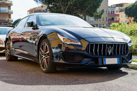 Rome, Italy - May 06, 2021: Elegant and modern profile view or fast and luxury Italian sedan car Maserati Quattroporte in blue navy color produced by Maserati automotiveのeditorial素材