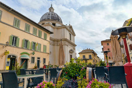 Castel Gandolfo downtown city street view at Liberty Square with ancient buildings and Church of San Tommaso da Villanova designed by Gian Lorenzo Bernini in 1658. The city its a famous tourist landmark in Roman Castles regional parkのeditorial素材
