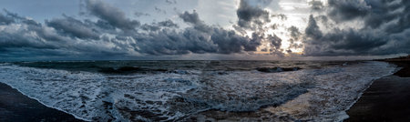 Sun sleeping at horizon over sea and night and bad weather will be come in a rough sea and dark...