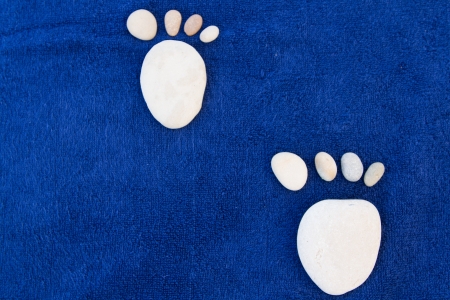 two feet maked by stonesの写真素材