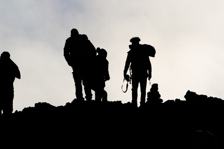 silhouettes of men on the volcano Etnaの写真素材