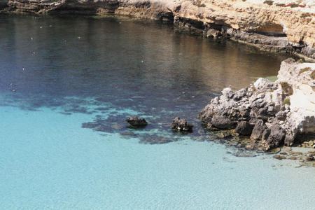 Pure crystalline water surface around an island - Lampedusa, Sicilyの写真素材